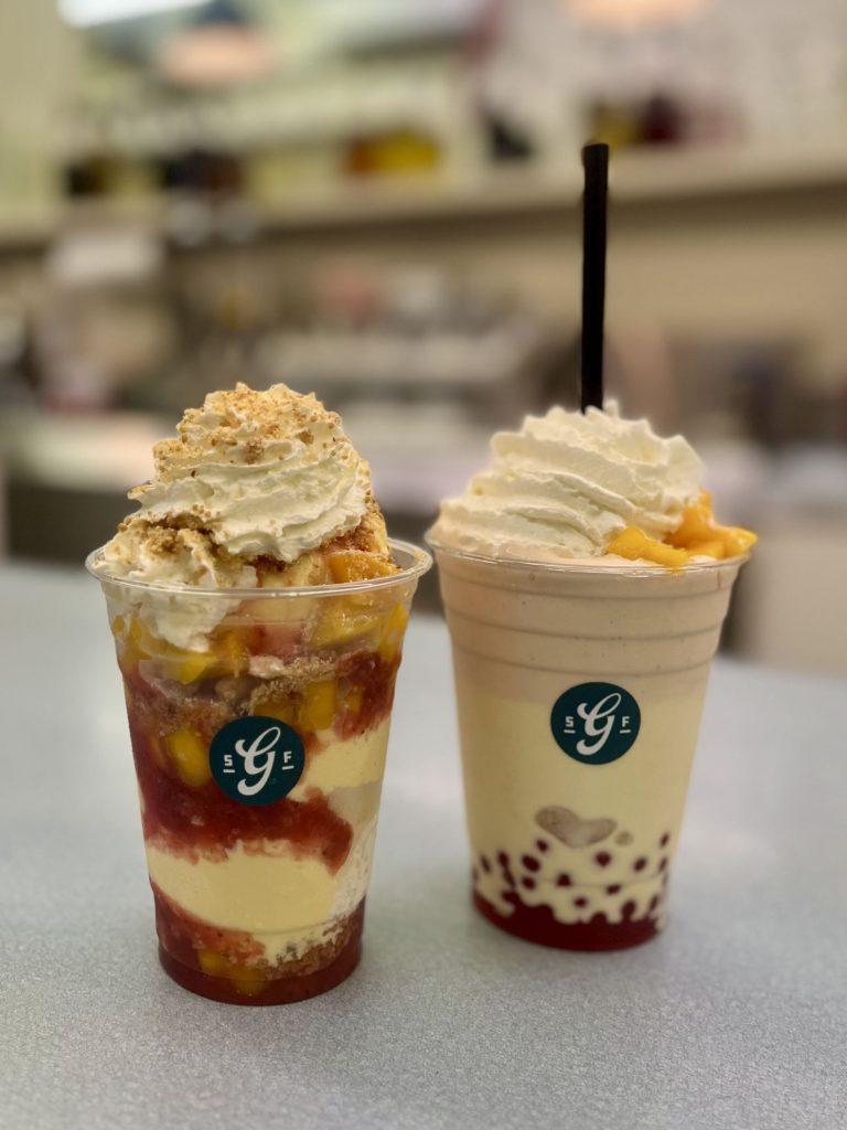 2 ice cream sodas with whipped cream