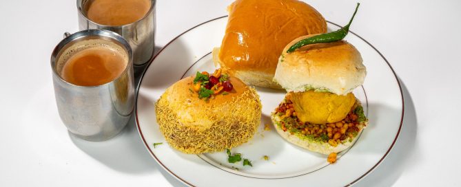 2 chai teas and 3 buns on a tray