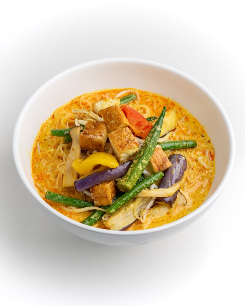 Colourful kaksa with mixed vegetables in white bowl from Singapore Hawker restaurant in Burnaby, BC