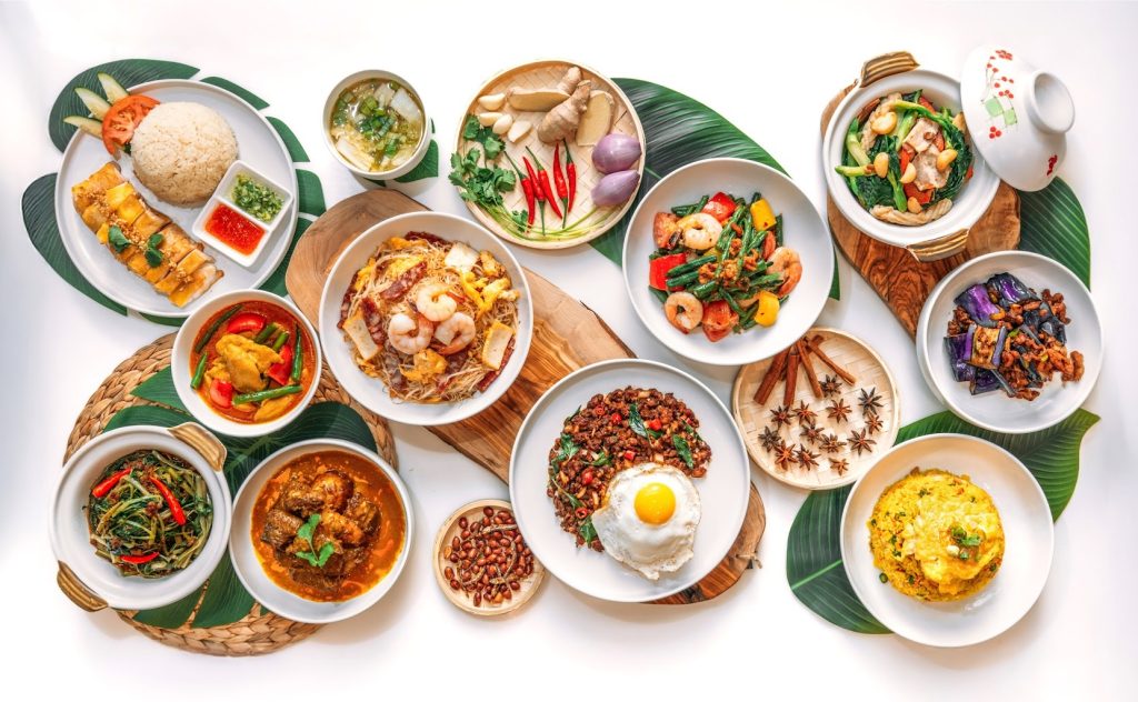 a display of 14 colourful singaporean dishes