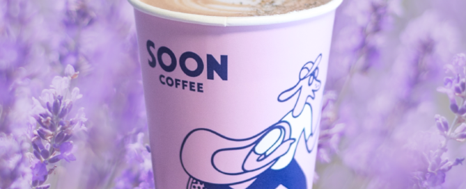 Coffee cup with lavender flower in background