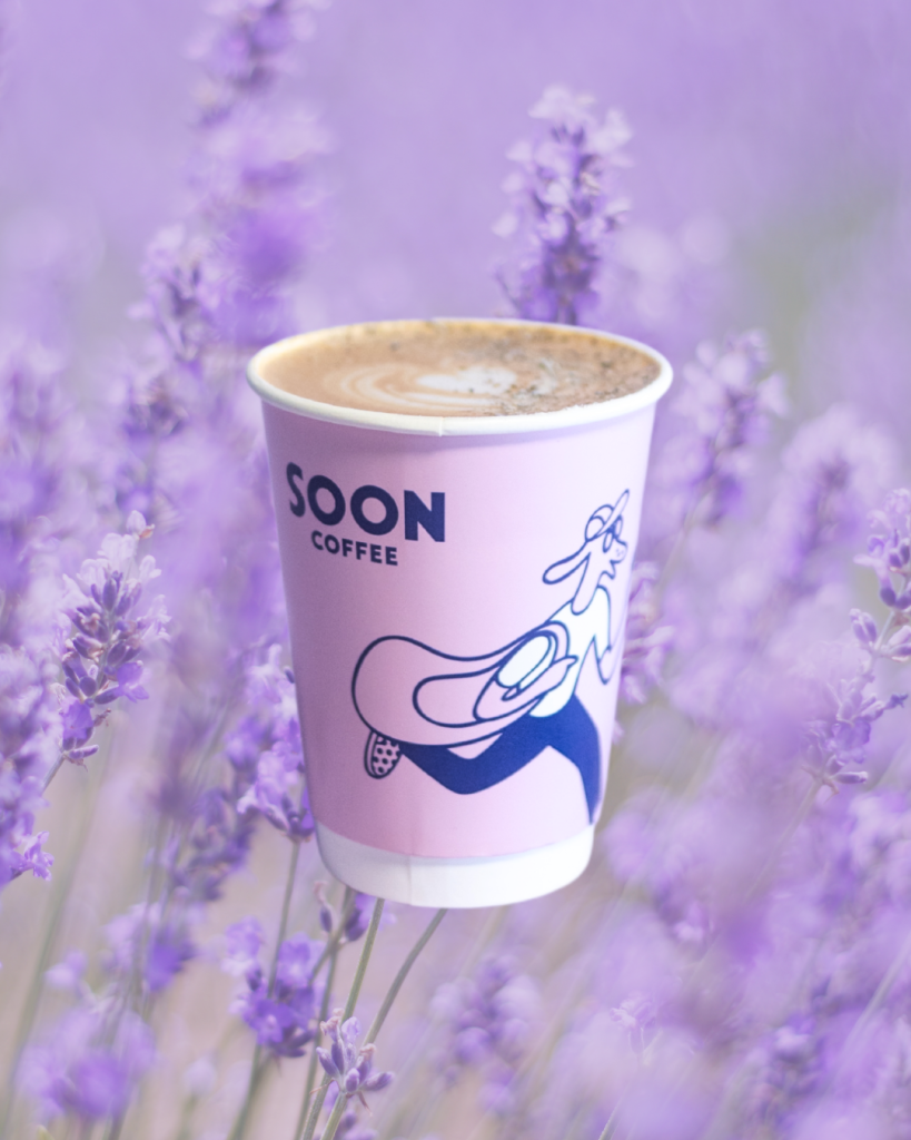 Coffee cup with lavender flower in background