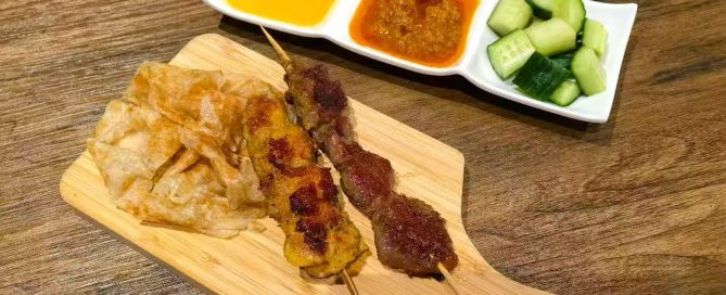 Image of chicken and beef skewers with roti bread