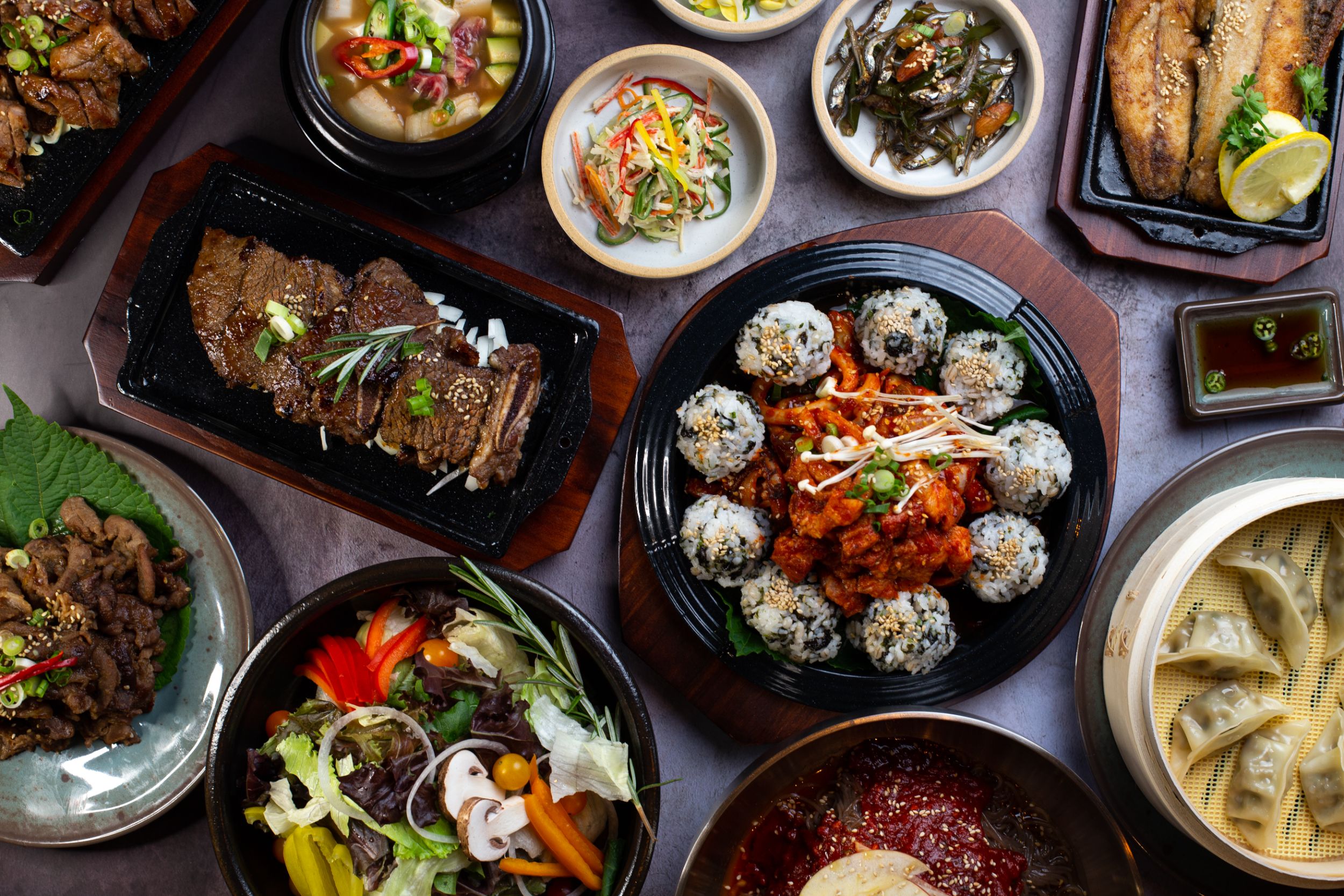 A colourful array of food dishes from Onggi Korean Cuisine